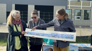 Brian McArthur (far right) and Dawn Detarando (Far left) from Voyager Art and Tile, with Métis artist Dawn Saunders Dahl (centre).