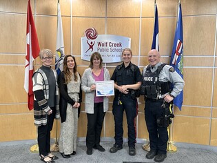 Photo Cutline: (Left to Right) Alberta School Boards’ Association Zone 4 Chair Kim Smyth presents the Friends of Education Award to Wolf Creek Public Schools’ (WCPS) Vice Chair Lana Thompson; Barb Reaney, WCPS Director of Safe And Caring Schools; Const. M